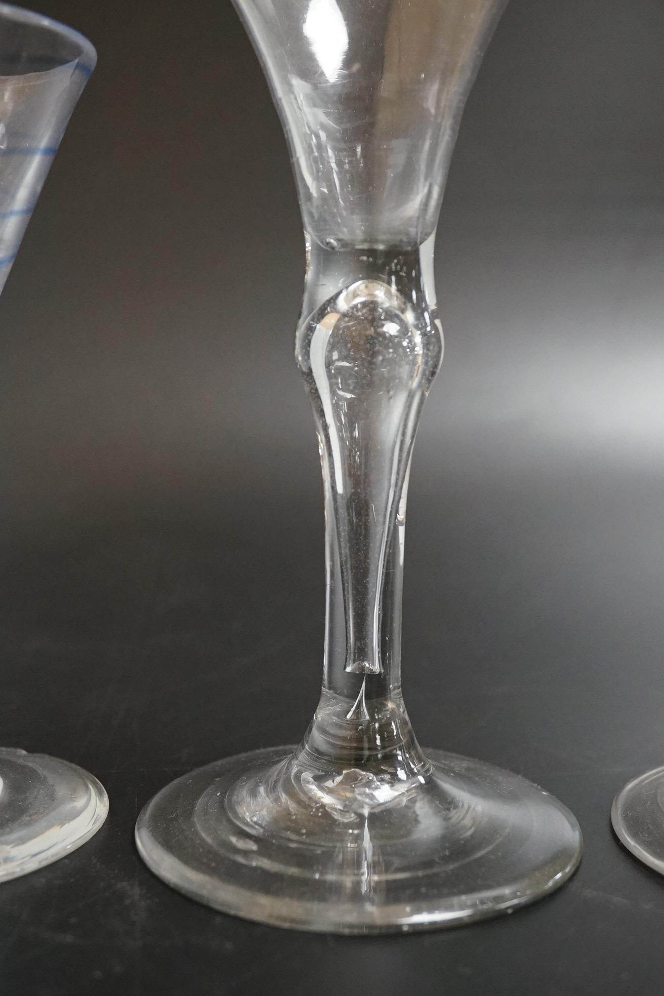 Two drawn wine glasses, each with air-tear stems, and a drawn-stem wine glass with blue internal twist, tallest 17cm high (3)